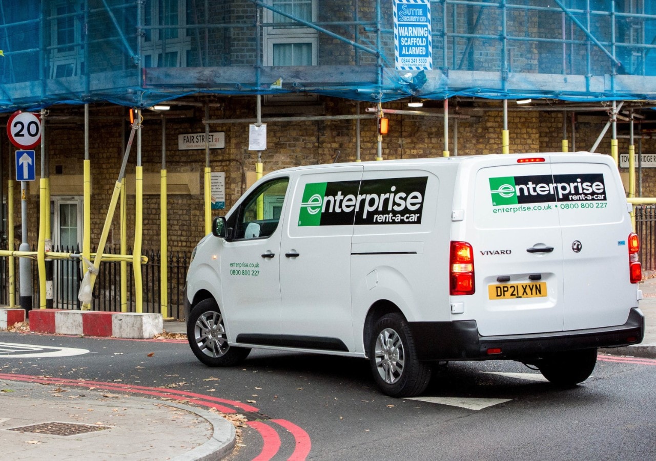 London UK. 25 September, 2021. An Enterprise Rent-A-Car vehicle drives past a ULEZ sign near Tower Bridge.